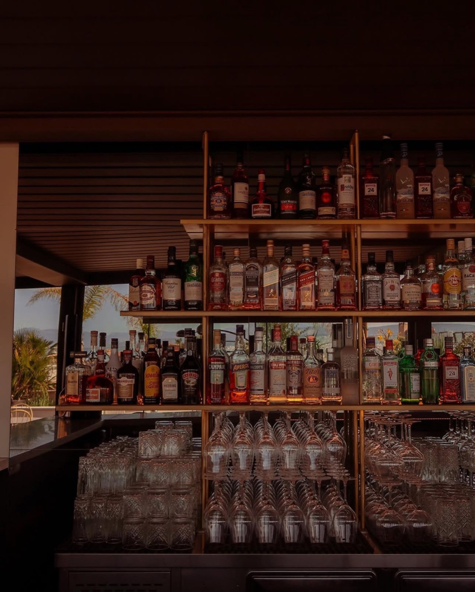 Backlit hotel bar and glassware, photographed for Jet2