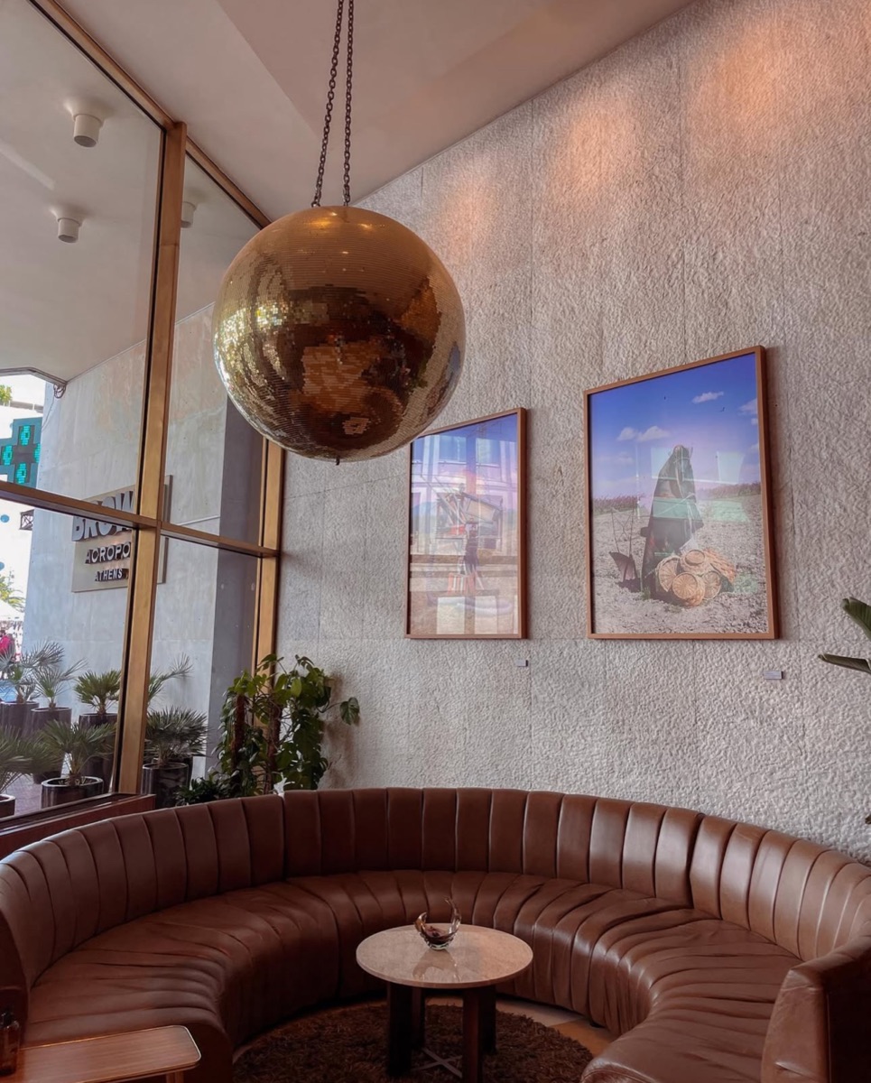 Hotel lounge with a mirrored disco ball and curved seating, photographed for Jet2