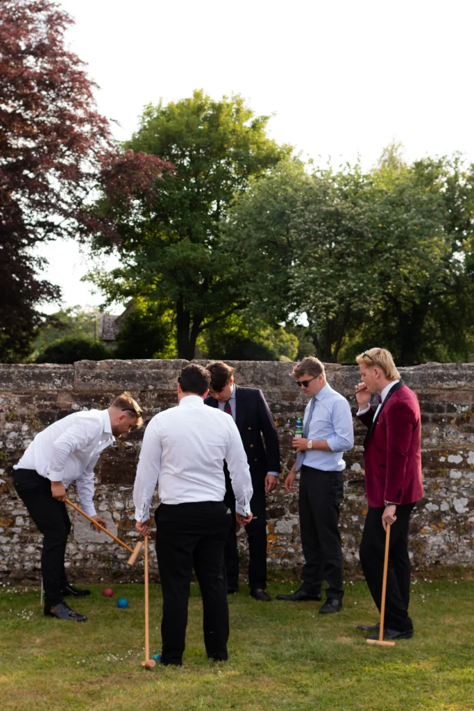Guests playing croquet on the lawn