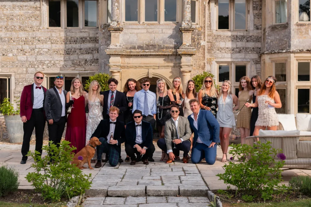 Group portrait of guests outside the country house