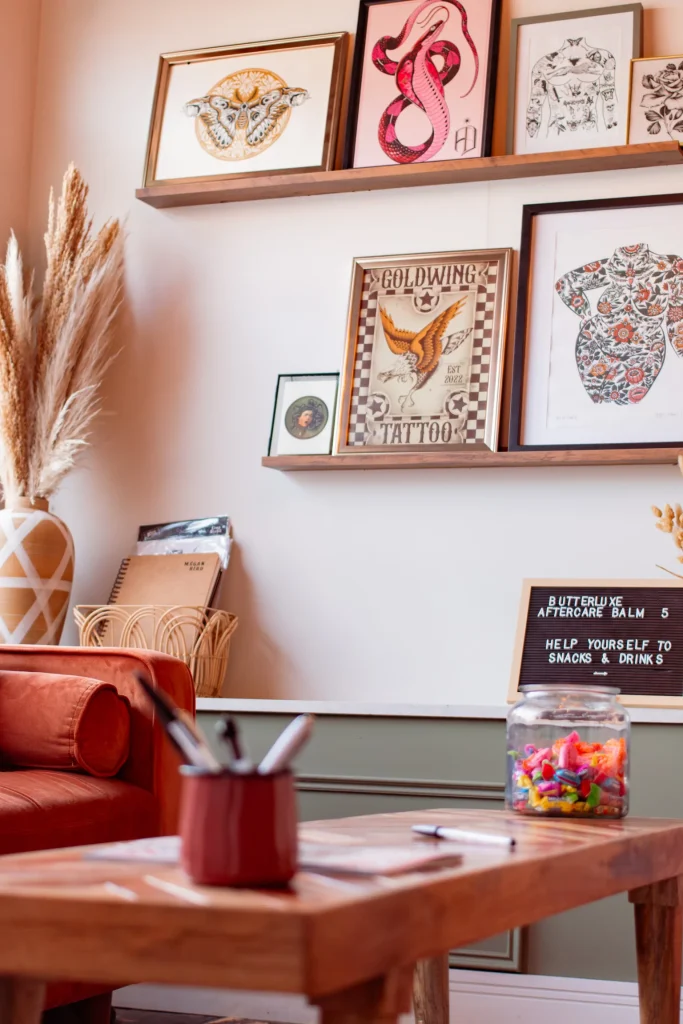 Goldwing Tattoo studio reception with framed artwork and seating