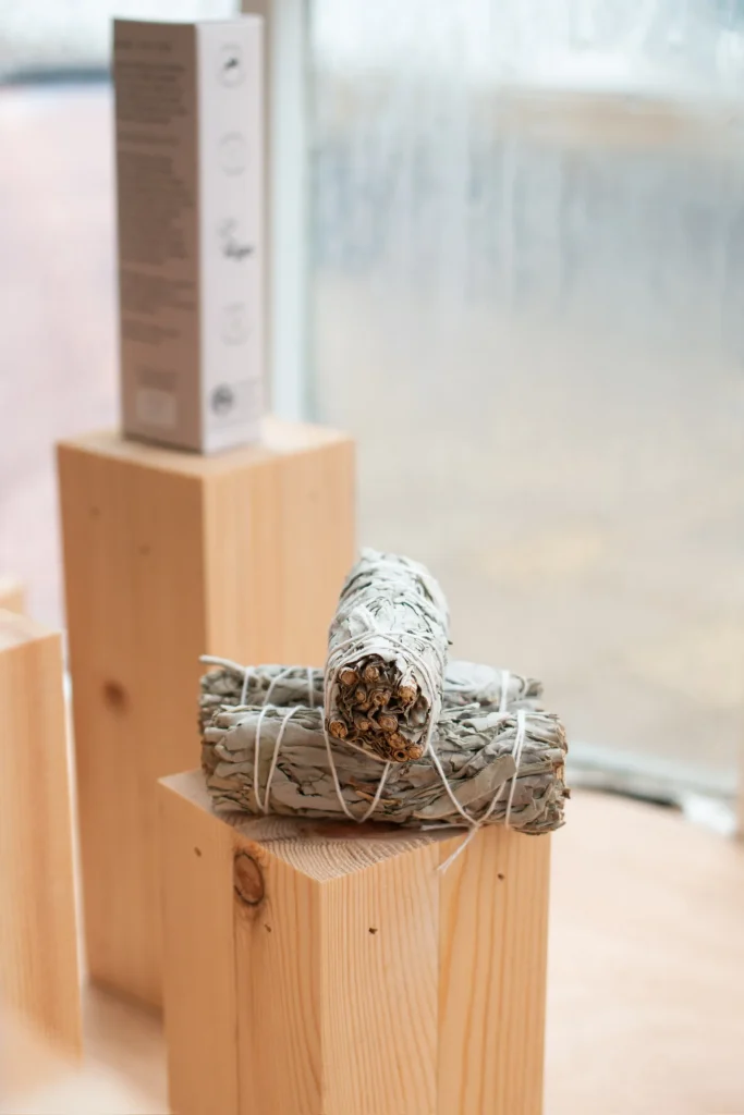 Tied herb bundles displayed on wooden stands